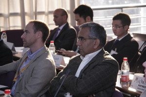 Participants listen to pnel presentations during the Plenary session. Front left to right: Mr. Shannon Knight (U.S. Pacific Command) and Brigadier Farid Ahmed (National Defense University, Pakistan). Back left to right: Mr. Mulosami Samiev (Committee for Emergencies and Civil Defense, Tajikistan), Mr. Alexander Yuan (U.S. Embassy Beijing), and Dr. Guo Jian (Cold and Arid Regions Environmental and Engineering Research Institute, China). 